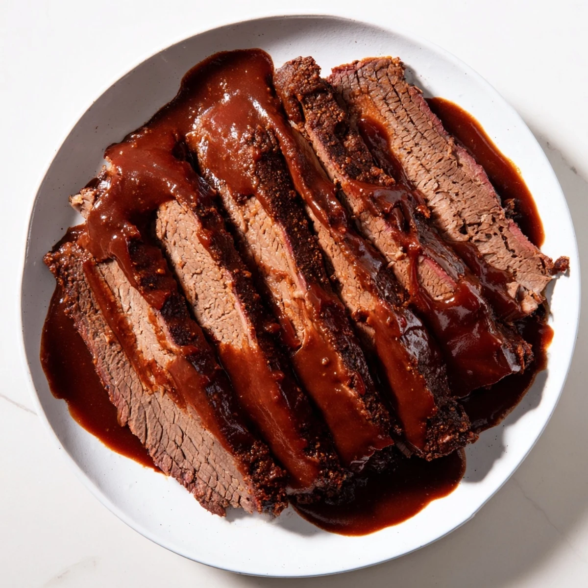 Sliced slow cooked beef brisket with smoky BBQ sauce arranged on a rustic wooden board, ready for a family gathering.