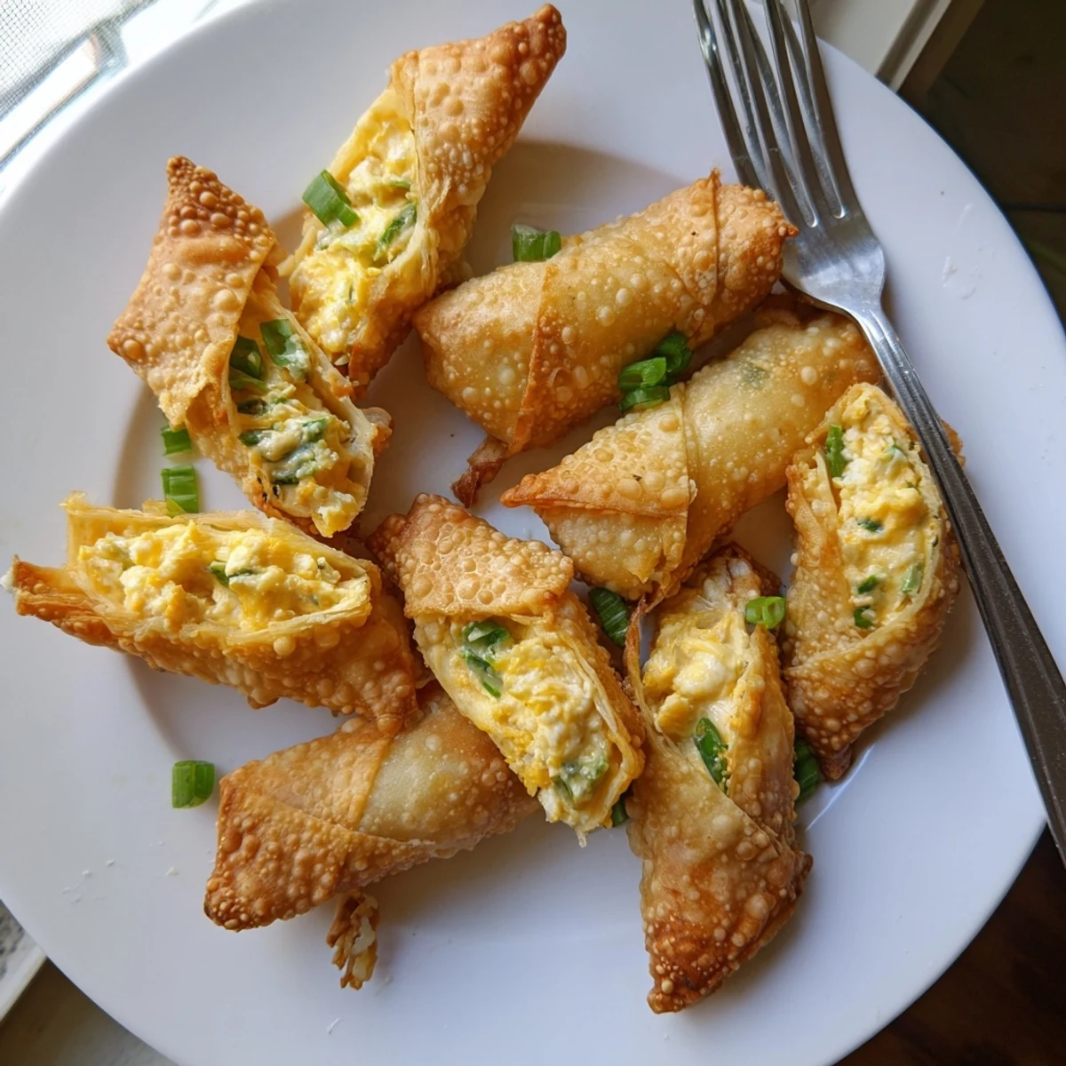 Crispy, golden fried Mini Jalapeño Popper Egg Rolls served with creamy ranch dip on a party platter.