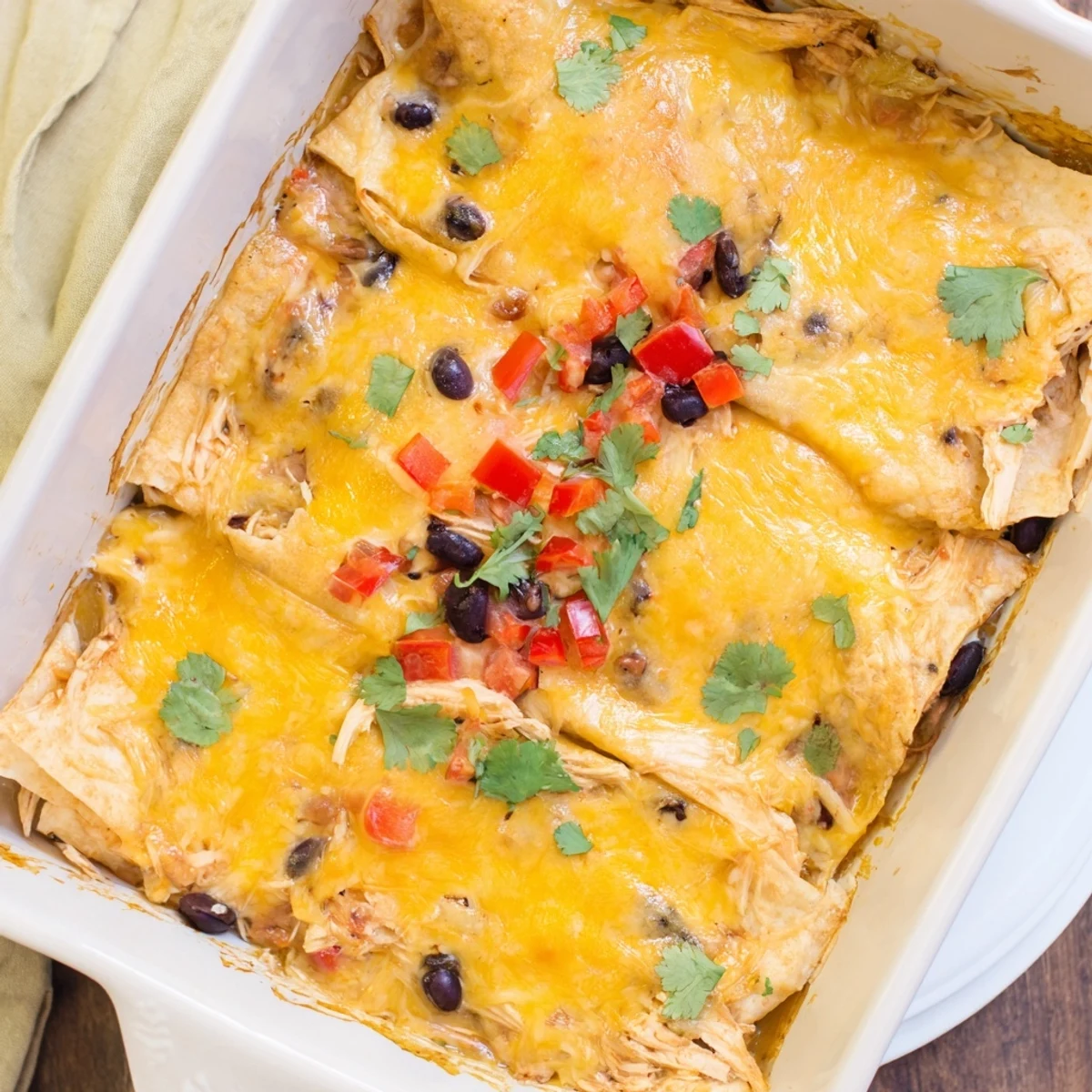 Sliced square reveals tender shredded chicken layers and melted cheddar inside this Mexican Italian fusion