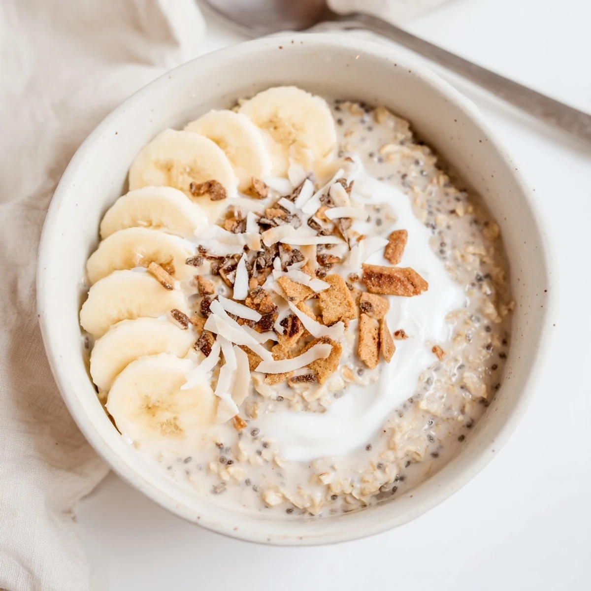 Vibrant Coconut Cream Pie Overnight Oats served cold with graham crumbs, toasted flakes