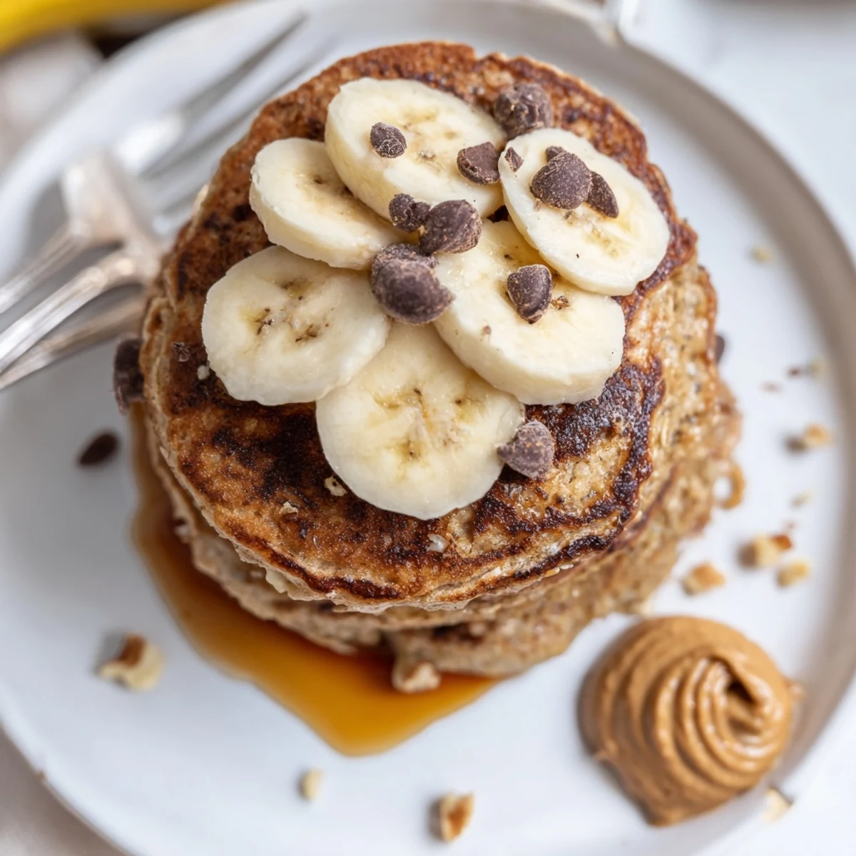 Fluffy Protein Banana Pancakes, nutty aroma, topped with berries and honey